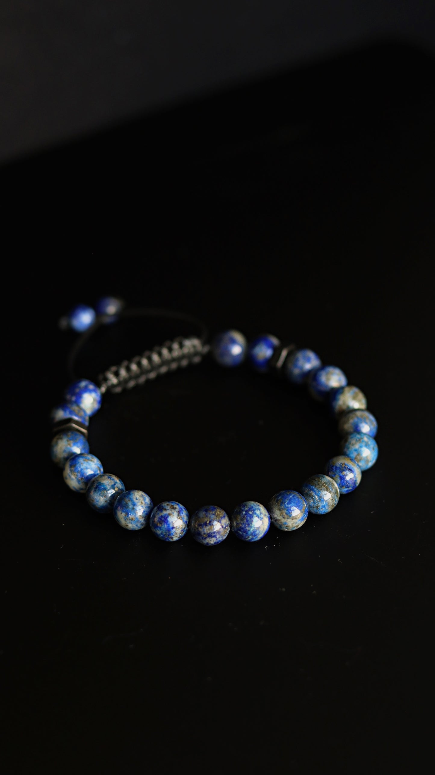 Lapis Lazuli beaded bracelet on a black background
