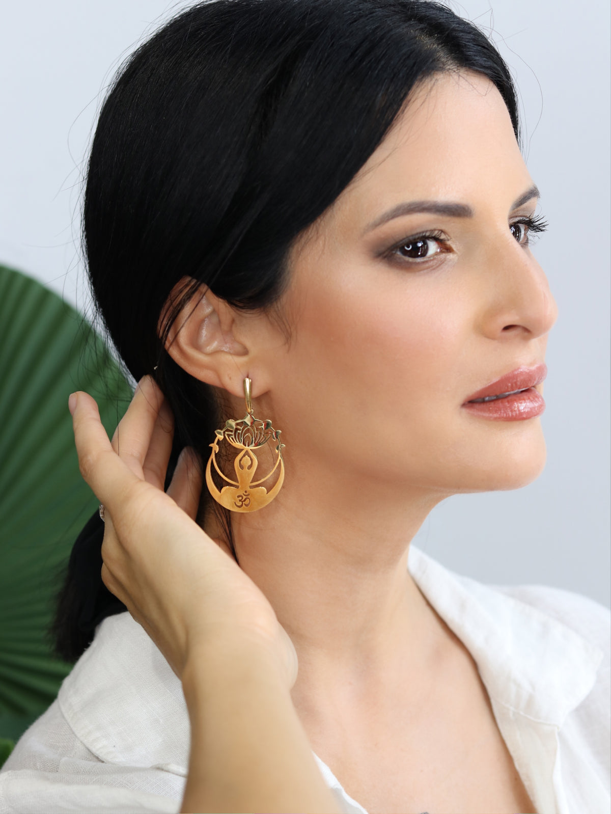 Gold lotus Om drop earrings with meditating figure, crescent moon and crown chakra lotus, 18k gold plated stainless steel by BURZAN Design