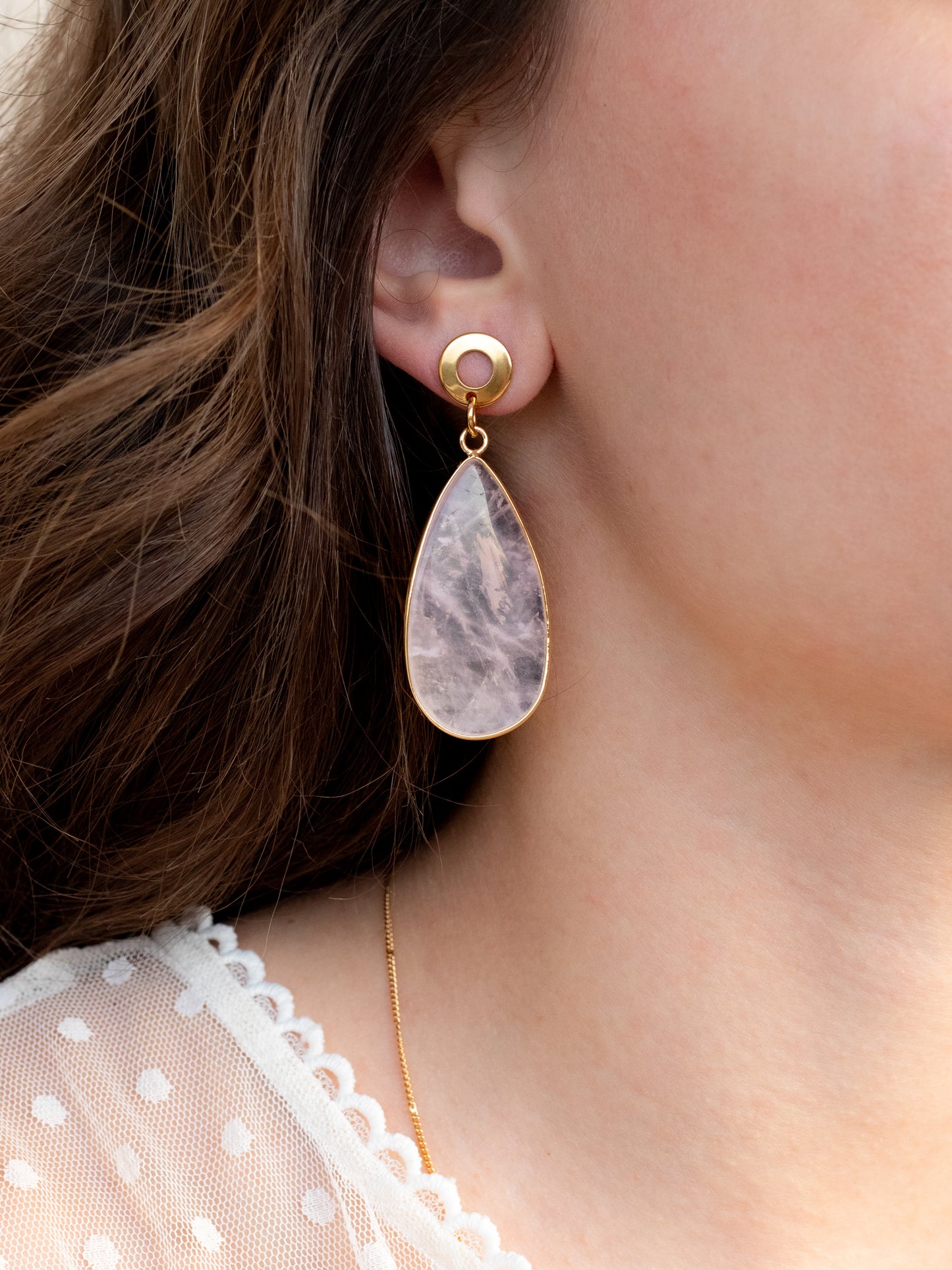 close up of teardrop earrings on a person, rose quartz gemstone, hypoallergenic