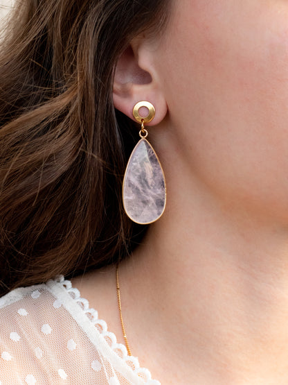 close up of teardrop earrings on a person, rose quartz gemstone, hypoallergenic